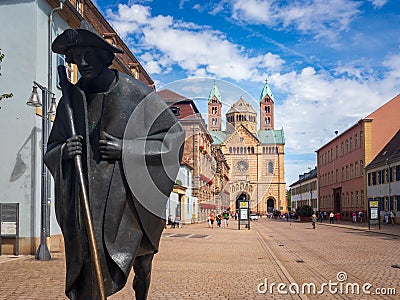 Pilgrim statue and western facade of Speyer Cathedral, Germany Editorial Stock Photo
